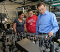 Cornell University's Chris Xu works with students.